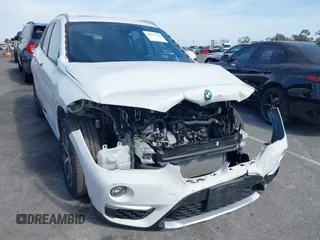 2018 BMW X1 xDrive28i with VIN WBXHT3C37J5K28375, listed as a IAAI auction lot 42039336 with 28,664 mi miles. Bid and sale history available at carsss.com. Image 1.