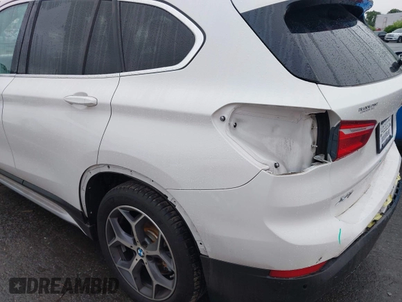 2019 BMW X1 xDrive28i with VIN WBXHT3C54K3H35641, listed as a IAAI auction lot 42241894 with 100,989 mi miles and . Bid and sale history available at DreamBid. Image 17.