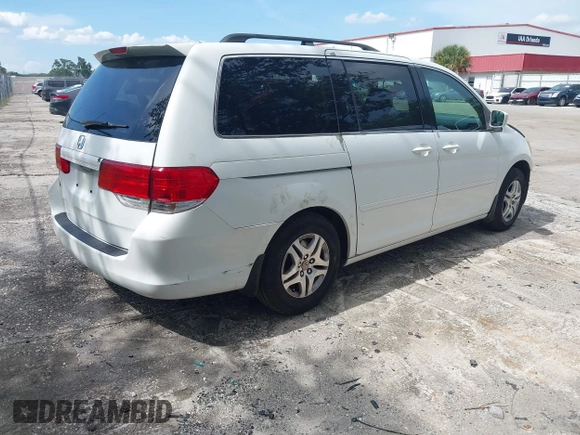 2010 Honda Odyssey EX with VIN 5FNRL3H5XAB015351, listed as a IAAI auction lot 42702296 with 202,919 mi miles and . Bid and sale history available at DreamBid. Image 4.