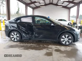 2023 Tesla Model Y Long Range with VIN 7SAYGAEE7PF739924, listed as a IAAI auction lot 41612323 with 75,226 mi miles and . Bid and sale history available at DreamBid. Image 12.