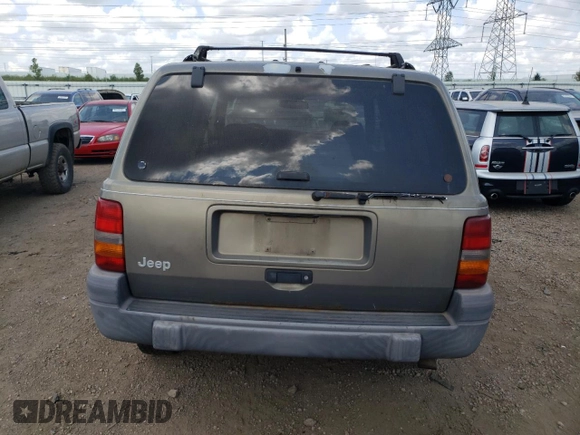 1997 Jeep Grand Cherokee Laredo z VIN 1J4GZ58S4VC502596, wystawiony jako Copart lot #88255865 z przebiegiem Nie podano mil oraz Nie do naprawy • Non repairable. Historia ofert i sprzedaży dostępna na DreamBid. Obrazek 6.
