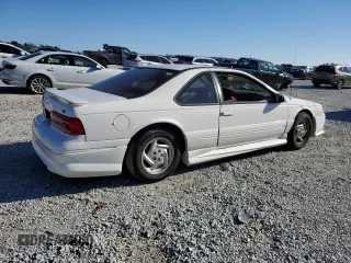 1997 Ford Thunderbird LX with VIN 1FALP62W0VH150654, listed as a Copart auction lot 86274524 with 119,203 mi miles and Salvage Title. Bid and sale history available at DreamBid. Image 3.