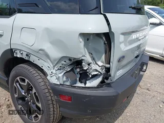 2023 Ford Bronco Sport Outer Banks z VIN 3FMCR9C64PRD05448, wystawiony jako IAAI lot #42375732 z przebiegiem 53 538 mil mil oraz . Historia ofert i sprzedaży dostępna na DreamBid. Obrazek 6.