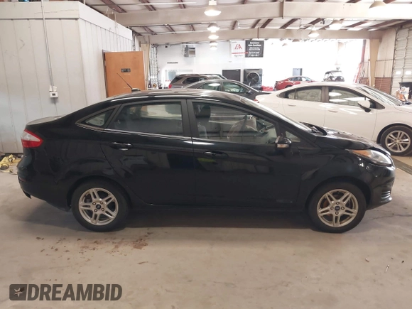 2018 Ford Fiesta SE z VIN 3FADP4BJ3JM141658, wystawiony jako IAAI lot #41737201 z przebiegiem 92 078 mil mil oraz . Historia ofert i sprzedaży dostępna na DreamBid. Obrazek 13.