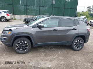 2020 Jeep Compass Trailhawk with VIN 3C4NJDDB3LT200268, listed as a IAAI auction lot 42250192 with 73,804 mi miles and . Bid and sale history available at DreamBid. Image 14.