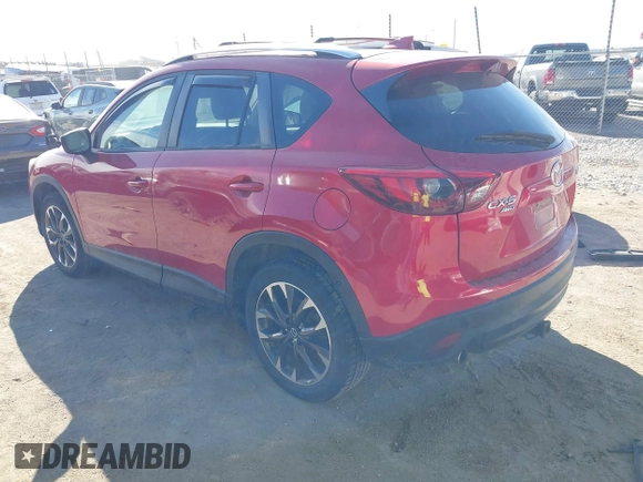2016 Mazda CX-5 Grand Touring with VIN JM3KE4DY0G0709563, listed as a IAAI auction lot 41886956 with 156,769 mi miles. Bid and sale history available at carsss.com. Image 3.