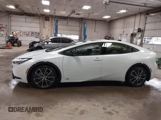 2024 Toyota Prius LE z VIN JTDADABU6R3024846, wystawiony jako IAAI lot #42256141 z przebiegiem 2 840 mil mil oraz . Historia ofert i sprzedaży dostępna na DreamBid. Obrazek 14.