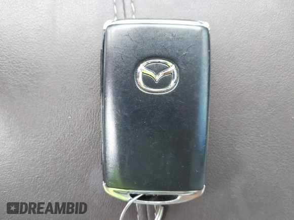 2021 Mazda CX-30 Premium z VIN 3MVDMBDL7MM236474, wystawiony jako IAAI lot #42284515 z przebiegiem 58 565 mil mil oraz . Historia ofert i sprzedaży dostępna na DreamBid. Obrazek 11.