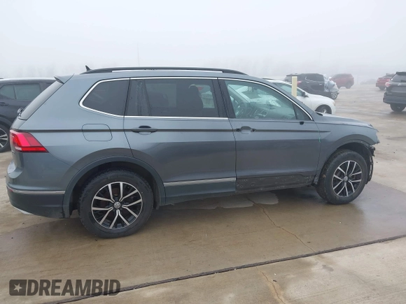2021 Volkswagen Tiguan SE with VIN 3VV2B7AX8MM143189, listed as a IAAI auction lot 41646843 with 56,672 mi miles and . Bid and sale history available at DreamBid. Image 13.