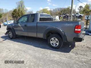 2007 Ford F-150 XLT with VIN 1FTPX14597NA52942, listed as a Copart auction lot 52980215 with 149,889 mi miles and Salvage Title. Bid and sale history available at carsss.com. Image 2.
