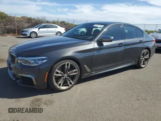 2019 BMW 5 Series M550i xDrive with VIN WBAJB9C57KB289036, listed as a Copart auction lot 86292134 with 28,103 mi miles and Salvage title. Bid and sale history available at DreamBid. Image 1.