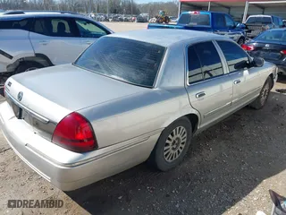 2007 Mercury Grand Marquis LS with VIN 2MEFM75V77X601170, listed as a IAAI auction lot 41517369 with 210,800 mi miles. Bid and sale history available at carsss.com. Image 4.