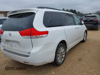 2011 Toyota Sienna XLE with VIN 5TDDK3DC0BS015244, listed as a IAAI auction lot 41413002 with 128,591 mi miles. Bid and sale history available at carsss.com. Image 4.