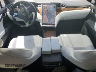 2016 Tesla Model X 70D with VIN 5YJXCAE28GF017100, listed as a Copart auction lot 50081235 with 126,962 mi miles and Salvage Title. Bid and sale history available at DreamBid. Image 8.