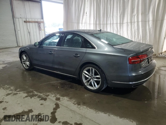 2015 Audi A8 z VIN WAUJGAFDXFN008499, wystawiony jako Copart lot #87658385 z przebiegiem 103 175 mil mil oraz Szkoda całkowita • Salvage title. Historia ofert i sprzedaży dostępna na DreamBid. Obrazek 2.