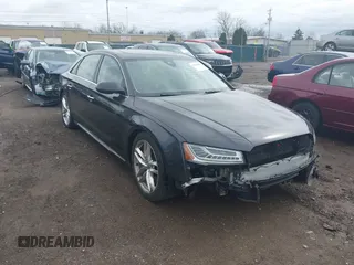 2016 Audi A8 L 4.0T Sport with VIN WAU43AFD3GN020763, listed as a IAAI auction lot 41951858 with 104,563 mi miles. Bid and sale history available at carsss.com. Image 1.
