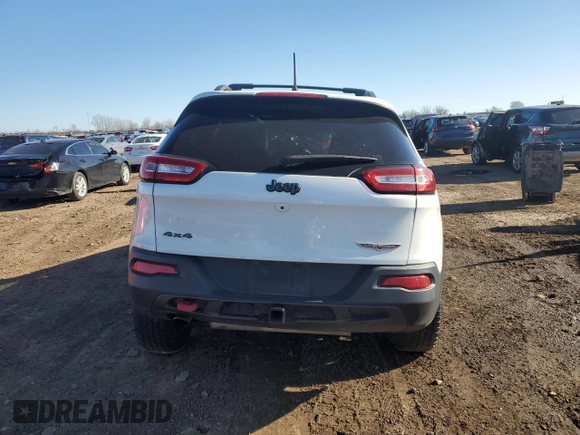 2017 Jeep Cherokee Trailhawk L Plus with VIN 1C4PJMBB3HW506965, listed as a Copart auction lot 82257594 with 106,571 mi miles and Salvage title. Bid and sale history available at DreamBid. Image 6.