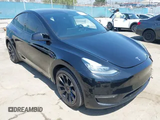 2023 Tesla Model Y Long Range z VIN 7SAYGDEE0PA023719, wystawiony jako IAAI lot #41974415 z przebiegiem 50 152 mil mil oraz . Historia ofert i sprzedaży dostępna na DreamBid. Obrazek 1.