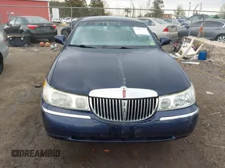 2001 Lincoln Town Car Signature with VIN 1LNHM82W61Y733577, listed as a IAAI auction lot 41899175 with 105,083 mi miles and . Bid and sale history available at DreamBid. Image 12.