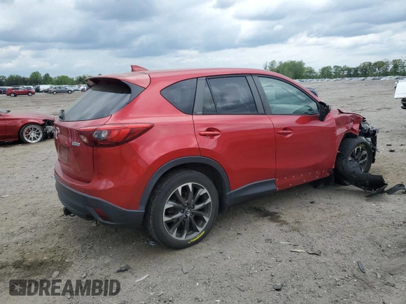 2016 Mazda CX-5 Grand Touring with VIN JM3KE4DY0G0664379, listed as a Copart auction lot 54659005 with 116,022 mi miles and Salvage Title. Bid and sale history available at DreamBid. Image 3.