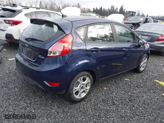 2016 Ford Fiesta SE with VIN 3FADP4EJ1GM112115, listed as a IAAI auction lot 41035038 with 150,722 mi miles. Bid and sale history available at carsss.com. Image 4.