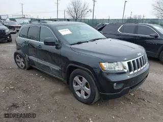 2011 Jeep Grand Cherokee Laredo with VIN 1J4RR4GGXBC511475, listed as a IAAI auction lot 41554620 with 164,361 mi miles. Bid and sale history available at carsss.com. Image 1.