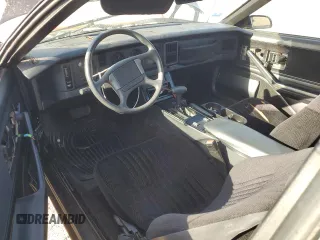 1989 Pontiac Firebird z VIN 1G2FS2186KL212458, wystawiony jako Copart lot #56995025 z przebiegiem 89 851 mil mil oraz Szkoda całkowita • Salvage title. Historia ofert i sprzedaży dostępna na DreamBid. Obrazek 8.