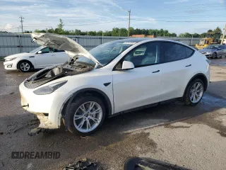 2023 Tesla Model Y Long Range z VIN 7SAYGDEE5PF791022, wystawiony jako Copart lot #54855965 z przebiegiem Nie podano mil oraz Szkoda całkowita • Salvage title. Historia ofert i sprzedaży dostępna na DreamBid. Obrazek 1.