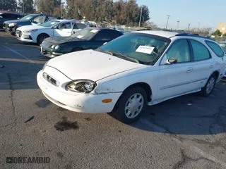 1998 Mercury Sable LS with VIN 1MEFM55U1WG608826, listed as a IAAI auction lot 41433046 with 138,291 mi miles. Bid and sale history available at carsss.com. Image 2.