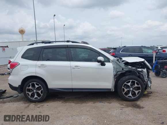 2014 Subaru Forester XT Touring with VIN JF2SJGMC4EH555465, listed as a IAAI auction lot 42357371 with 168,378 mi miles and . Bid and sale history available at DreamBid. Image 14.