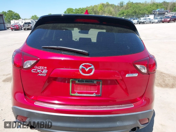 2015 Mazda CX-5 Grand Touring with VIN JM3KE4DY5F0469439, listed as a IAAI auction lot 42053851 with 70,676 mi miles. Bid and sale history available at carsss.com. Image 16.