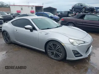 2014 Scion FR-S z VIN JF1ZNAA19E9702378, wystawiony jako IAAI lot #41651026 z przebiegiem 119 963 mil mil oraz . Historia ofert i sprzedaży dostępna na DreamBid. Obrazek 1.