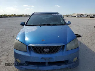 2005 Kia Spectra with VIN KNAFE161555082073, listed as a Copart auction lot 77062804 with 173,387 mi miles and Salvage Title. Bid and sale history available at carsss.com. Image 5.