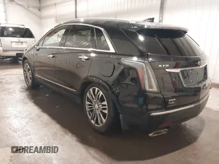 2019 Cadillac XT5 Premium Luxury AWD z VIN 1GYKNFRSXKZ189590, wystawiony jako IAAI lot #41316561 z przebiegiem 98 755 mil mil oraz . Historia ofert i sprzedaży dostępna na DreamBid. Obrazek 3.