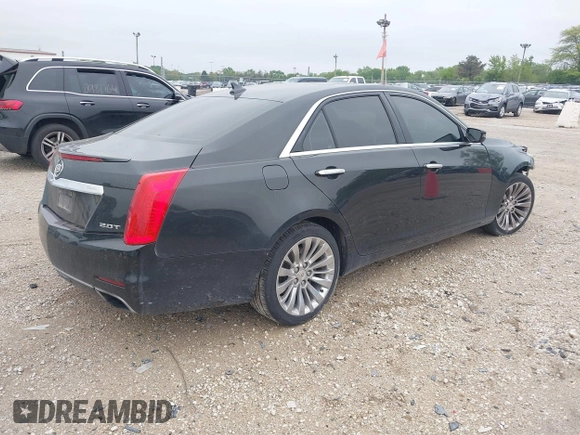 2014 Cadillac CTS Luxury AWD with VIN 1G6AX5SX9E0197395, listed as a IAAI auction lot 42211452 with 90,657 mi miles and . Bid and sale history available at DreamBid. Image 4.
