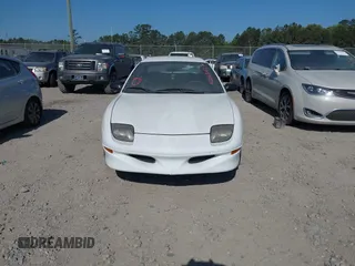 1999 Pontiac Sunfire SE z VIN 1G2JB5247X7575780, wystawiony jako IAAI lot #42143427 z przebiegiem Nie podano mil oraz . Historia ofert i sprzedaży dostępna na DreamBid. Obrazek 6.