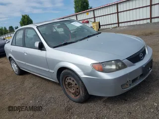 2002 Mazda Protege LX z VIN JM1BJ226X20523807, wystawiony jako IAAI lot #42373241 z przebiegiem 218 634 mil mil oraz . Historia ofert i sprzedaży dostępna na DreamBid. Obrazek 1.