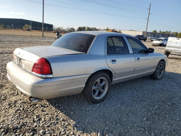 2004 Ford Crown Victoria LX with VIN 2FDFP74W74X150801, listed as a Copart auction lot 43869115 with 138,243 mi miles and Salvage Title. Bid and sale history available at carsss.com. Image 3.