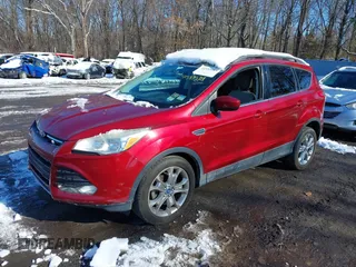 2014 Ford Escape SE with VIN 1FMCU0GX6EUA57609, listed as a IAAI auction lot 41533589 with 96,709 mi miles. Bid and sale history available at carsss.com. Image 2.