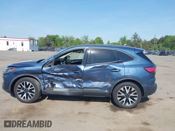 2020 Ford Escape SE Sport Hybrid with VIN 1FMCU9BZ6LUC38008, listed as a IAAI auction lot 42143784 with 81,804 mi miles and . Bid and sale history available at DreamBid. Image 14.