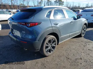 2023 Mazda CX-30 S Carbon Edition with VIN 3MVDMBCM3PM579345, listed as a IAAI auction lot 41689892 with 18,621 mi miles and . Bid and sale history available at DreamBid. Image 4.