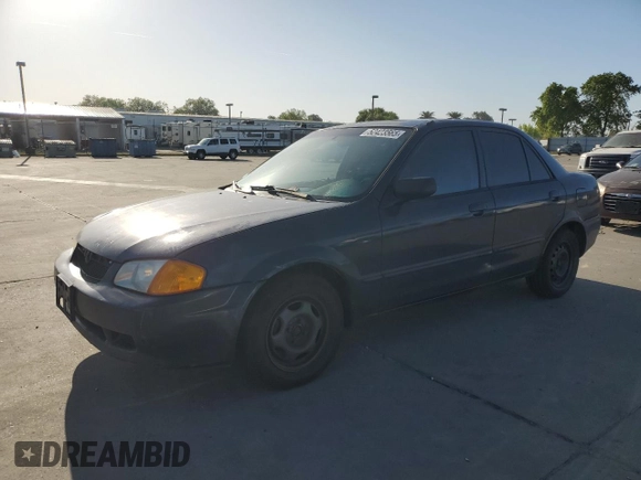 1999 Mazda Protege DX z VIN JM1BJ2227X0106522, wystawiony jako Copart lot #52423565 z przebiegiem 206 260 mil mil oraz Szkoda całkowita • Salvage title. Historia ofert i sprzedaży dostępna na DreamBid. Obrazek 1.