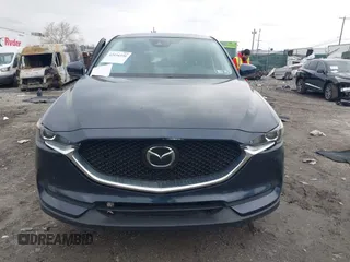 2021 Mazda CX-5 Touring with VIN JM3KFBCM1M1336457, listed as a IAAI auction lot 42034330 with 39,910 mi miles. Bid and sale history available at carsss.com. Image 11.