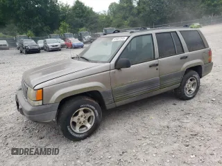 1998 Jeep Grand Cherokee Laredo z VIN 1J4GZ58S8WC158935, wystawiony jako Copart lot #61681345 z przebiegiem 197 508 mil mil oraz Czysty tytuł • Clean title. Historia ofert i sprzedaży dostępna na DreamBid. Obrazek 1.