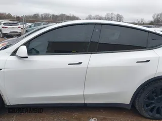 2021 Tesla Model Y Standard Range with VIN 5YJYGDED8MF114076, listed as a IAAI auction lot 41567295 with 150,133 mi miles and . Bid and sale history available at DreamBid. Image 13.