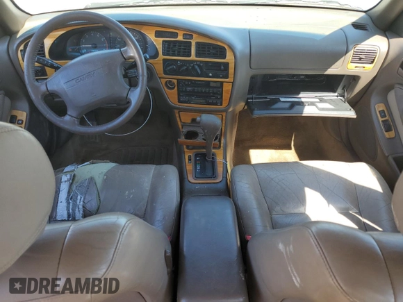 1996 Toyota Camry LE z VIN JT2BF12K5T0172341, wystawiony jako Copart lot #53384845 z przebiegiem 308 235 mil mil oraz Szkoda całkowita • Salvage title. Historia ofert i sprzedaży dostępna na DreamBid. Obrazek 8.