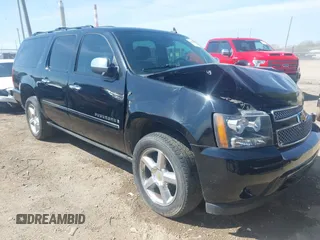 2009 Chevrolet Suburban LTZ with VIN 1GNFK36359R219818, listed as a IAAI auction lot 42120323 with 146,999 mi miles and . Bid and sale history available at DreamBid. Image 1.