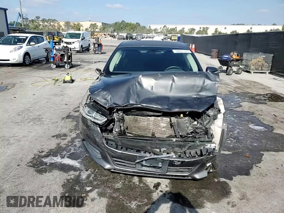 2015 Ford Fusion SE z VIN 3FA6P0HDXFR108055, wystawiony jako Copart lot #54801165 z przebiegiem 99 728 mil mil oraz Szkoda całkowita • Salvage title. Historia ofert i sprzedaży dostępna na DreamBid. Obrazek 13.
