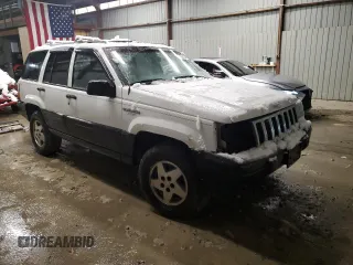 1995 Jeep Grand Cherokee Laredo with VIN 1J4GZ58S6SC630947, listed as a Copart auction lot 82143564 with 267,946 mi miles and Salvage Title. Bid and sale history available at carsss.com. Image 4.
