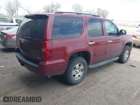 2007 Chevrolet Tahoe LTZ with VIN 1GNFK130X7J313106, listed as a IAAI auction lot 42042891 with 199,763 mi miles and . Bid and sale history available at DreamBid. Image 4.